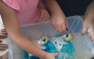 Children playing with lemons