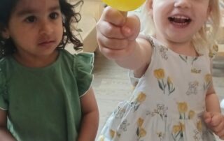 Children playing with ice lollies